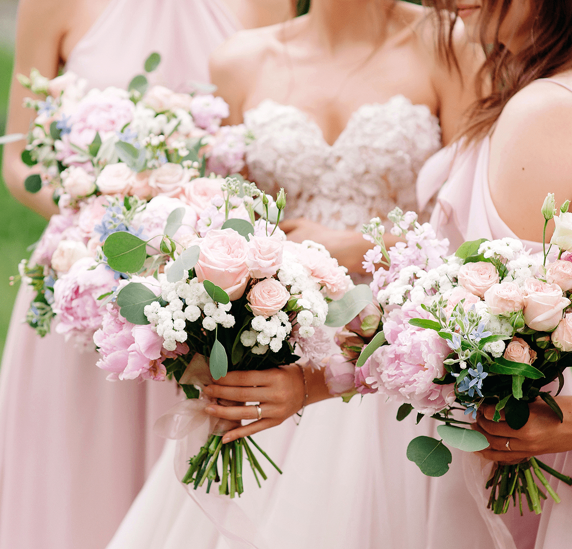 img1 (1) A group of women holding bouquets of flowers.